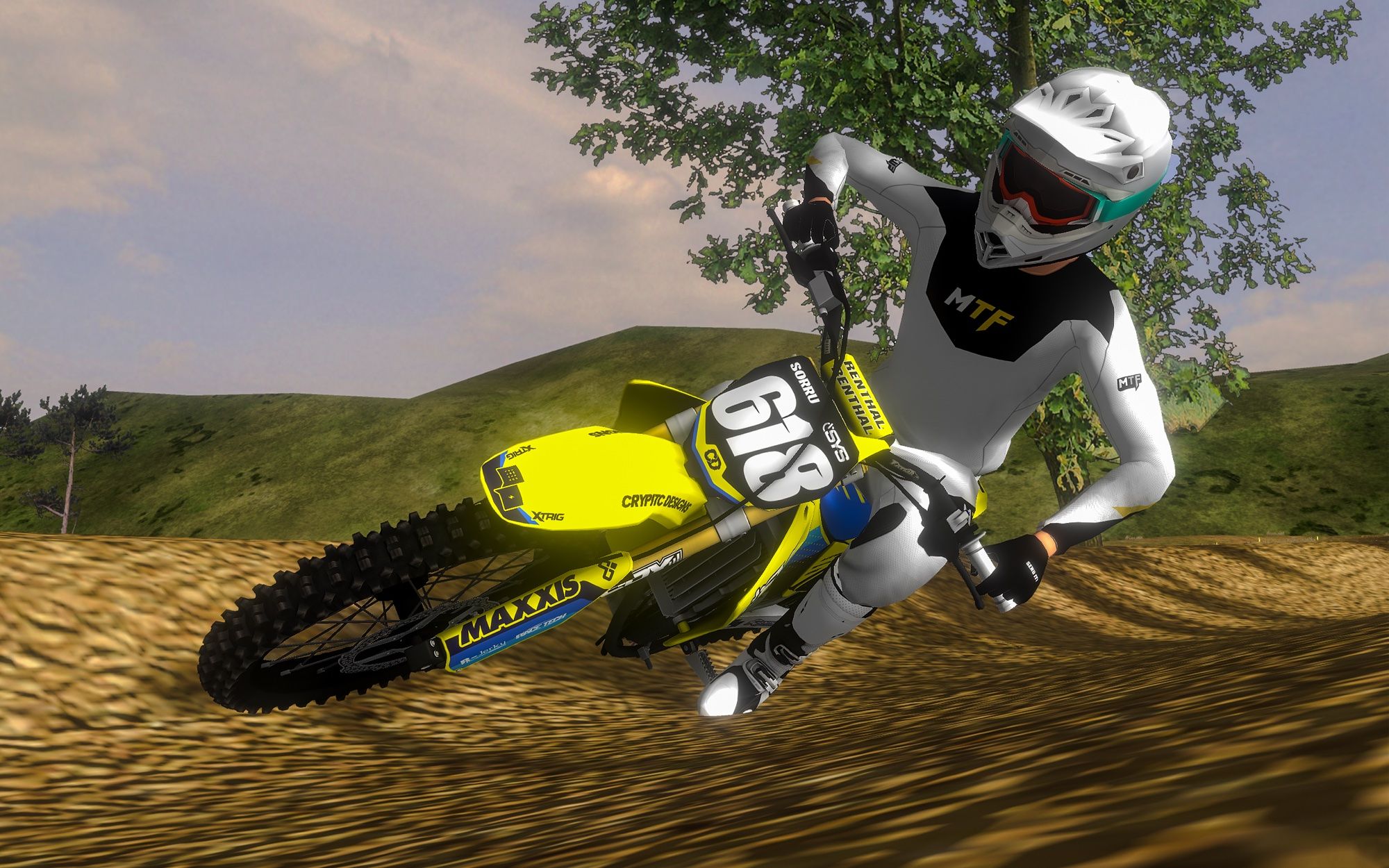 Rider on a yellow number 618 bike cornering on a dirt track